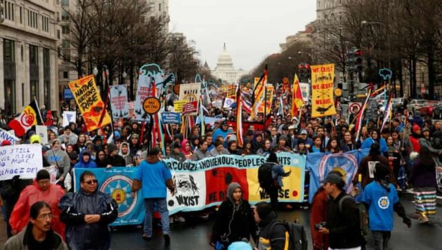 Photos of protest march and rally in opposition to the Dakota Access and Keystone XL pipelines in Washington in 2017.