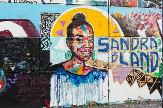 A painted mural of Sandra Bland, who was unable to afford bail and died while held in the Waller County Jail in Texas.