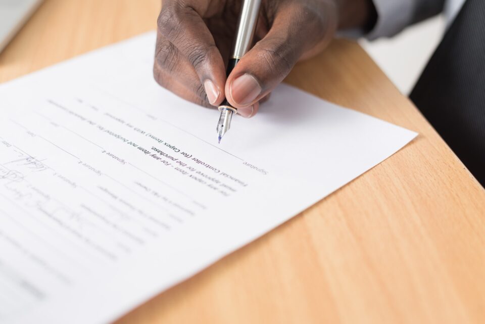 Person about to sign a contract