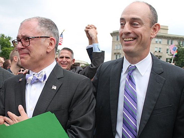An emotional James Obergefell walks alongside his attorney, Al Gerhardstein, during a rally on marriage equality decision day.