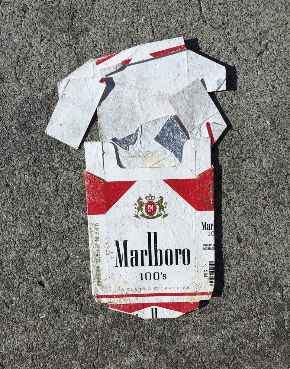 A flattened carton of Marlboro cigarettes, an American brand of cigarettes owned and manufactured by Philip Morris 