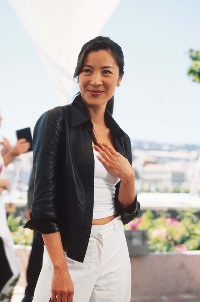 Michelle Yeoh standing outside at Cannes in 2000.