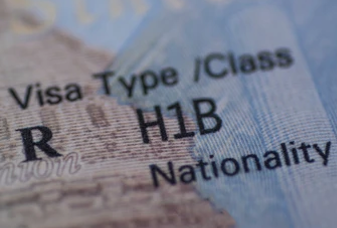  A close-up image of the text “H-1B” on an H-1B visa. 