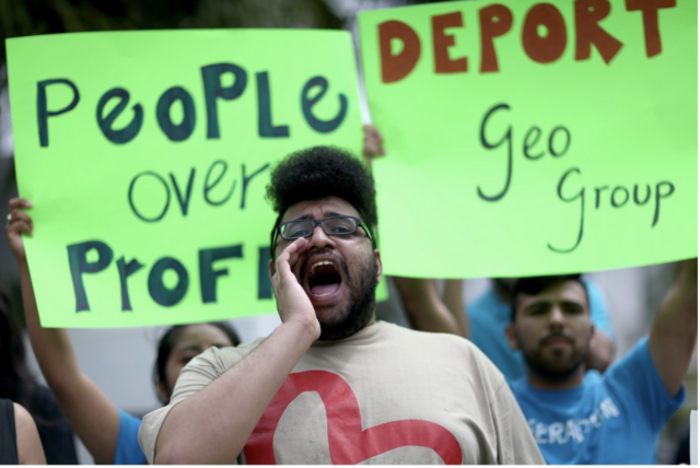 Protesters in front of the GEO Group headquarters in 2015 in Boca Raton, Florida. 