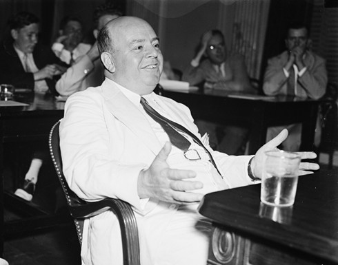 Howard Hopson smiles smugly at a 1935 Senate hearing.