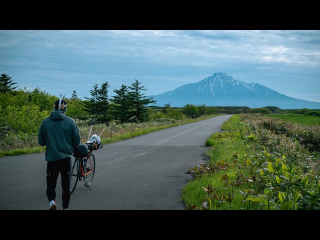 A cyclist preparing to set out on a journey across the length of Japan.