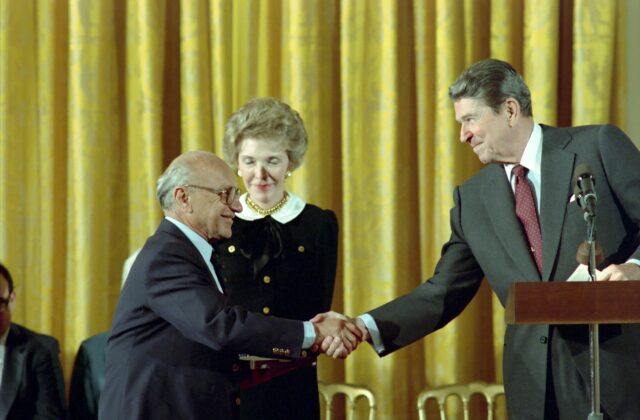 President Ronald Reagan and Nancy Reagan congratulating Milton Friedman on receiving the Presidential Medal of Freedom in 1988.